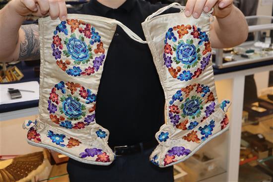 A Chinese embroidered skirt, a pair of embroidered boots, waistcoat and cover